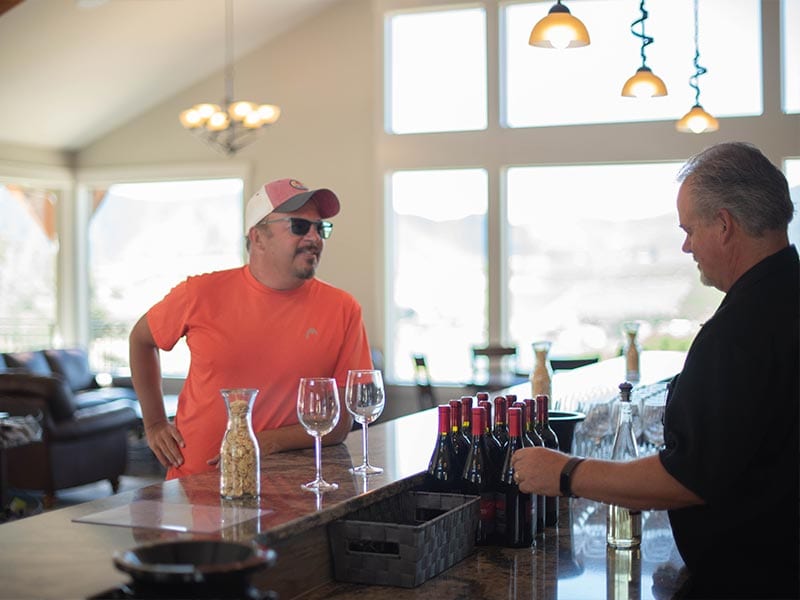 man being served wine by a Tipsy Canyon Winery expert